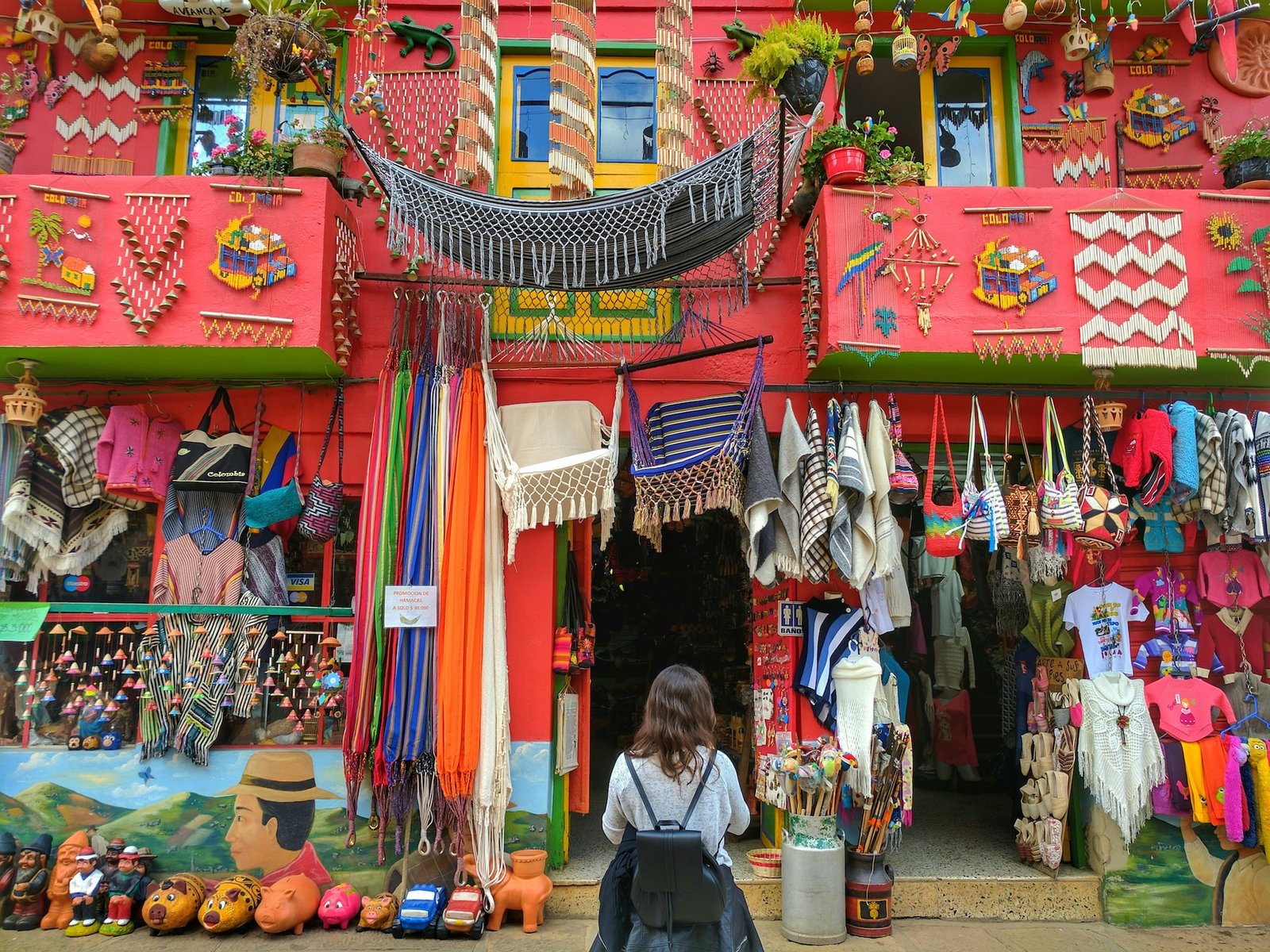Traveller browsing a vivid Colombian craft and souvenir shop
