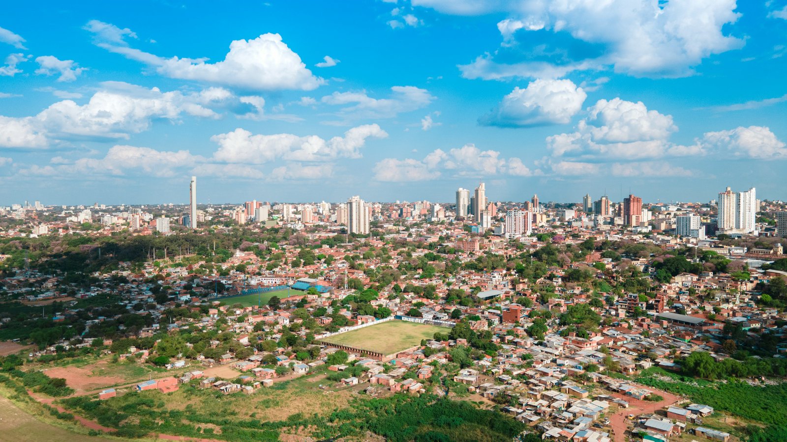 Aerial view of Asunción spreading across the flat landscape of Paraguay