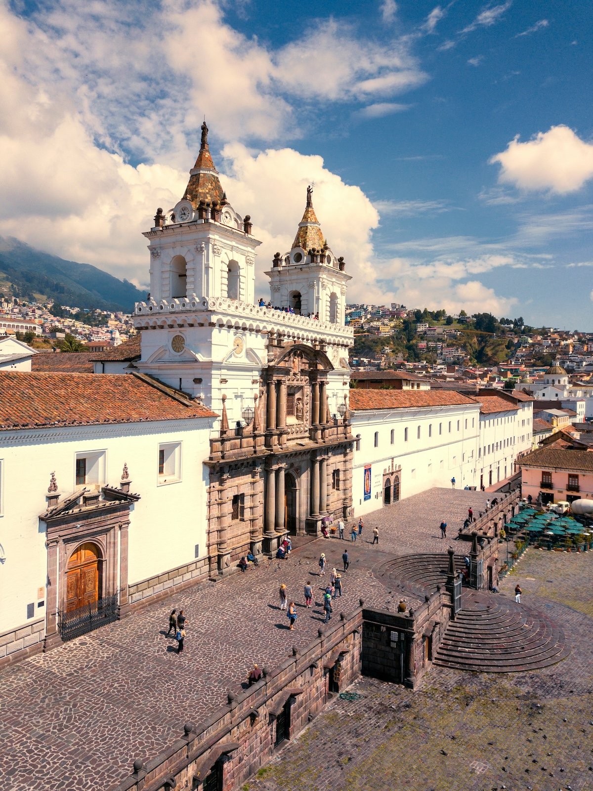 Aerial view of Plaza de San Francisco and the Andes mountains behind Quito's historic center, Ecuador