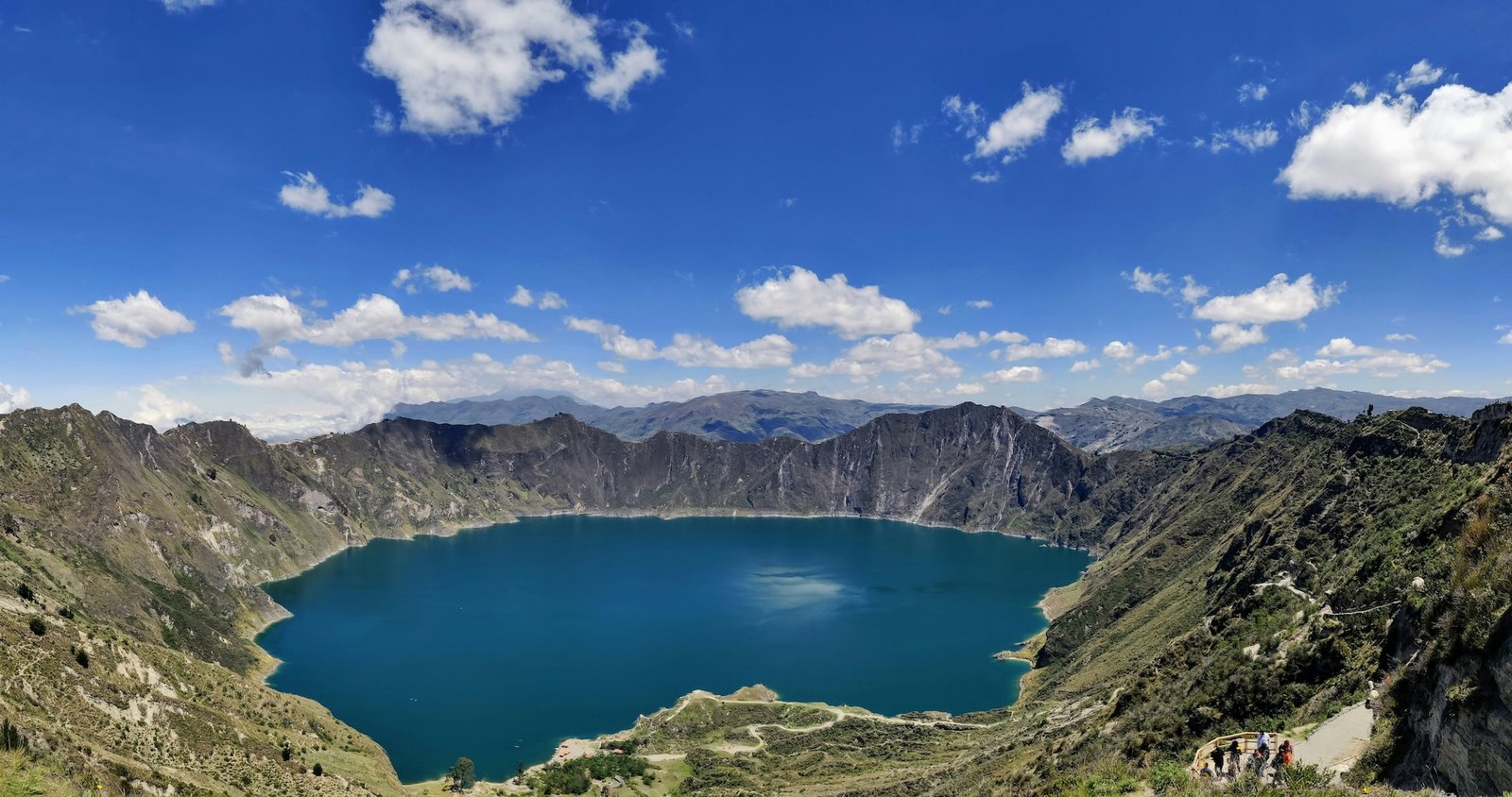 The luminous turquoise crater lake of Quilotoa fills a collapsed volcanic caldera in the Ecuadorian Andes