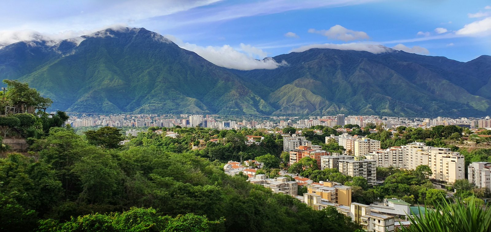 Caracas nestled in its valley with the El Ávila mountain range towering behind the city, Venezuela
